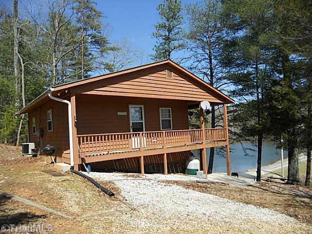 Exterior Front. Exterior front of home with one of large ponds in Wildlife Club in background