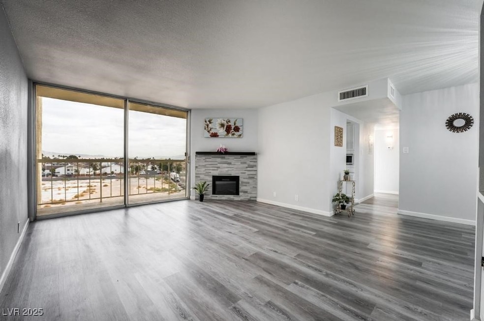 Unfurnished living room featuring expansive window
