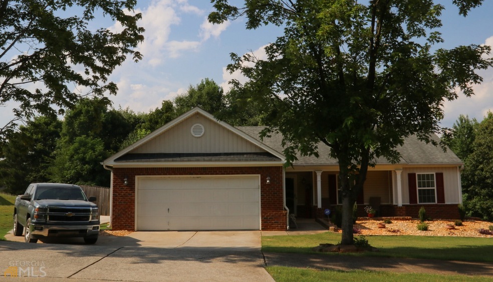 Front of House. Two Car Garage and Third Parking P