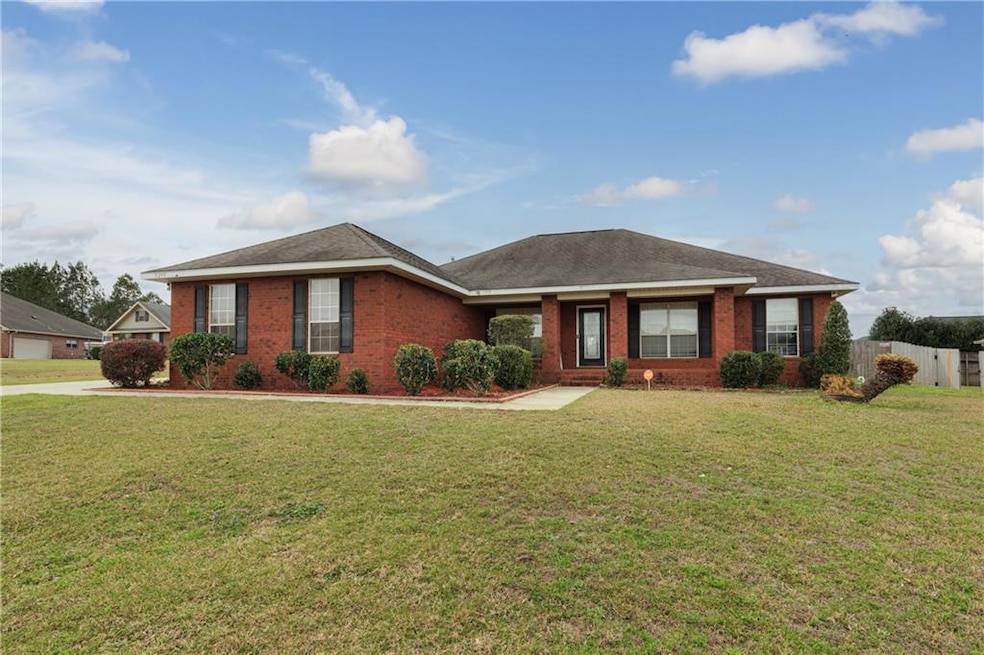 Ranch-style house with brick siding