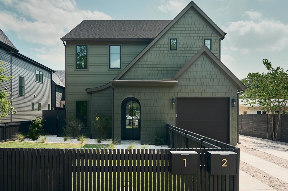 View of front of house with a fenced front yard, 