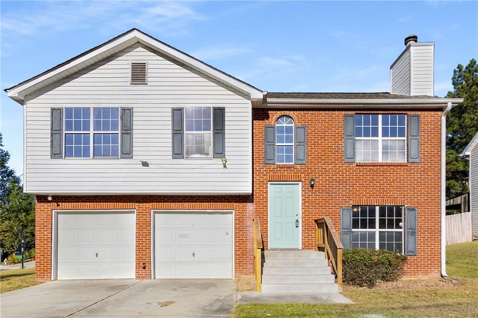 View of front of property featuring a garage