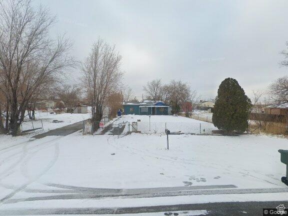 View of yard covered in snow