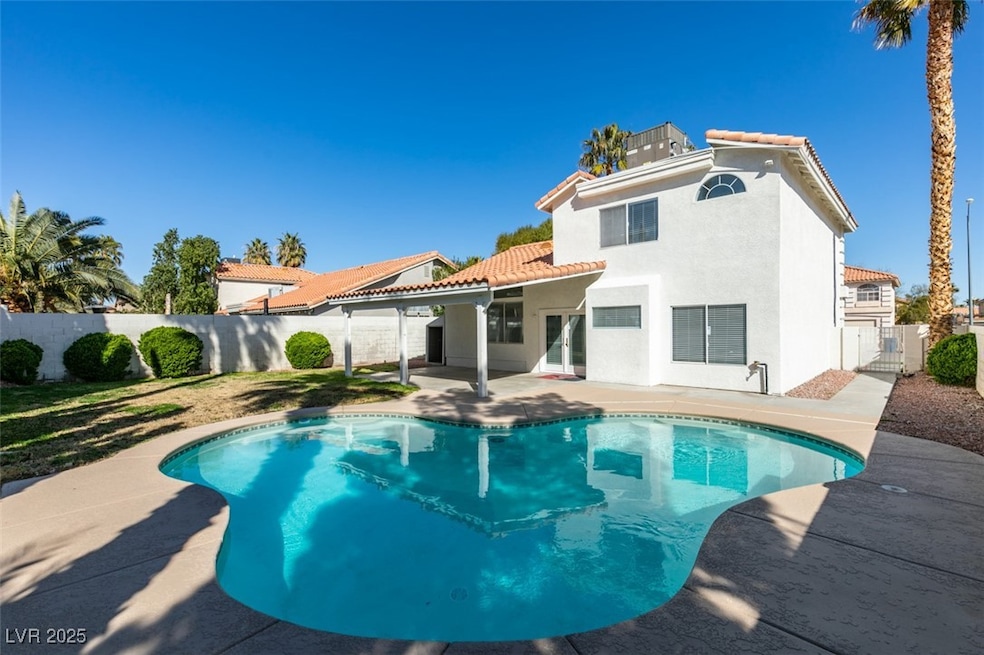 Back of property with a patio area, a fenced backy