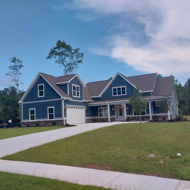 Craftsman-style home featuring a garage and a fron