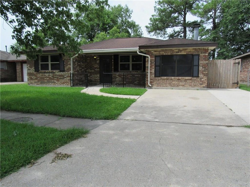 Front of home has a nice porch and large side driv