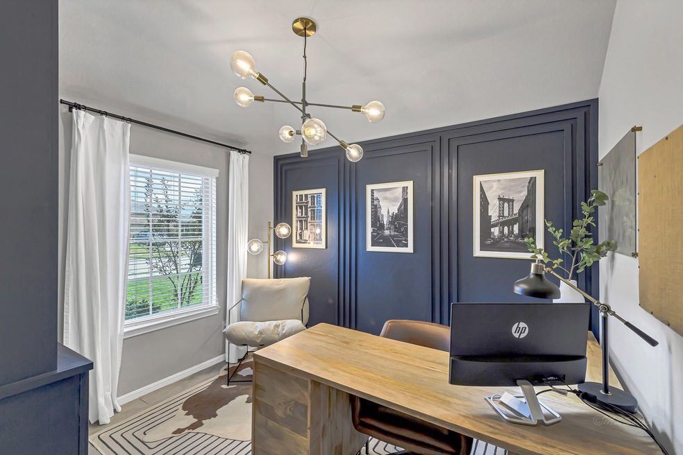 This home office has custom built-ins w/LED lighting