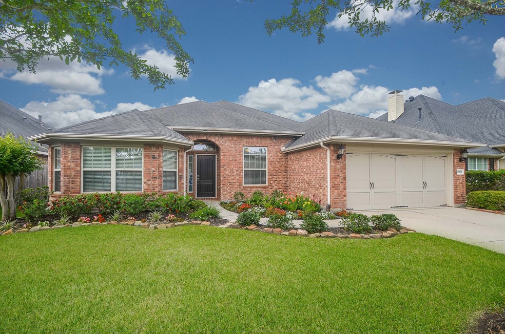 Begin your journey through the home with a beautiful entrance surrounded by an impressive landscape.

