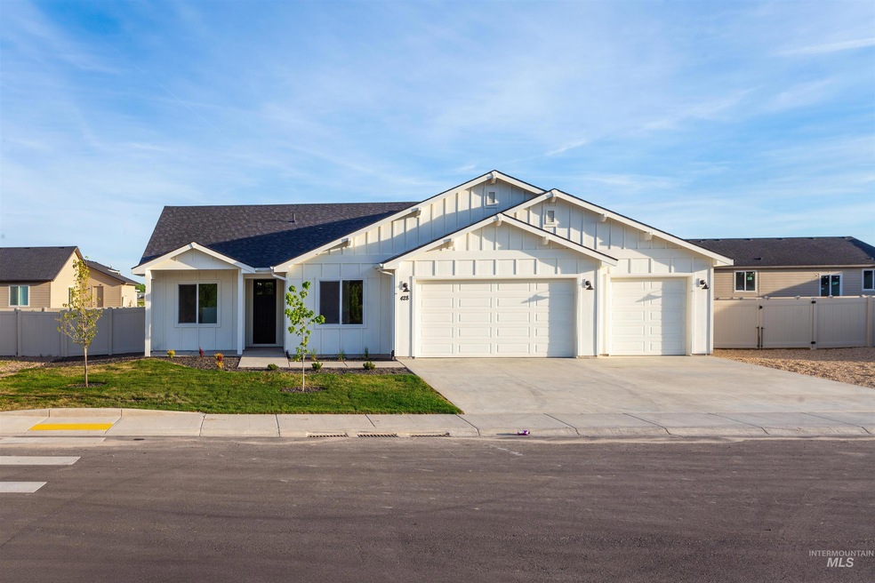 Modern inspired farmhouse featuring board and batten siding, a garage, concrete driveway, and a shingled roof