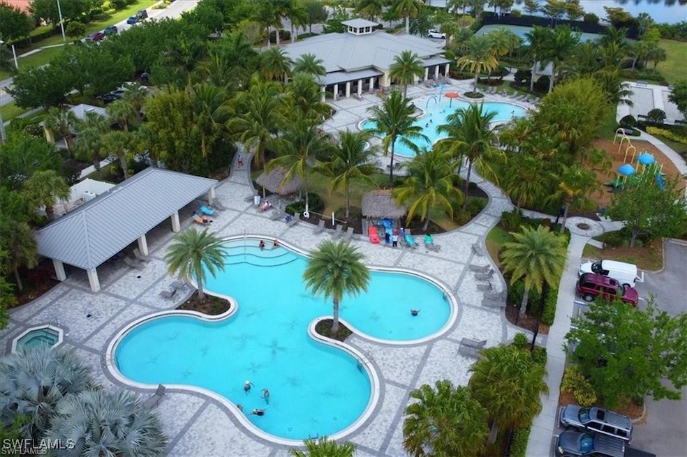 Community pool with a grill and a patio