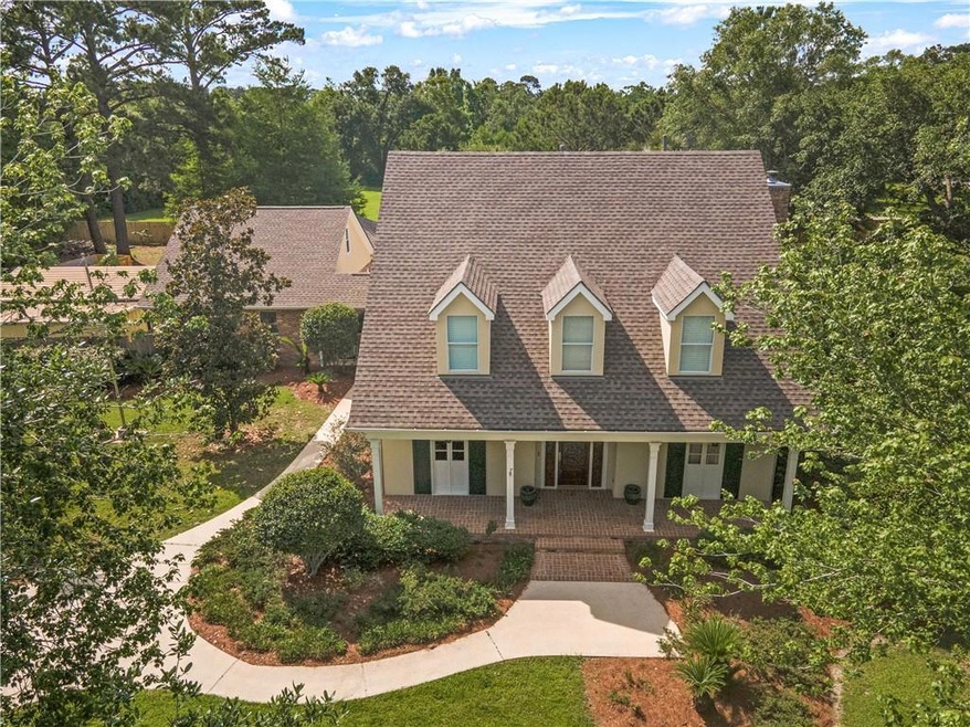 This amazing, all-brick,Acadian-style front porch