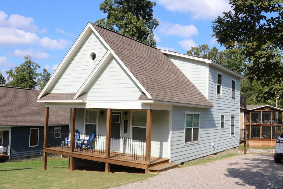 Rear view of property featuring a yard and a porch