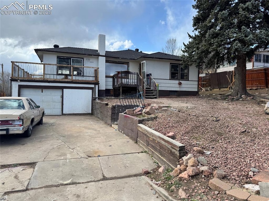 Single story home with concrete driveway, attached