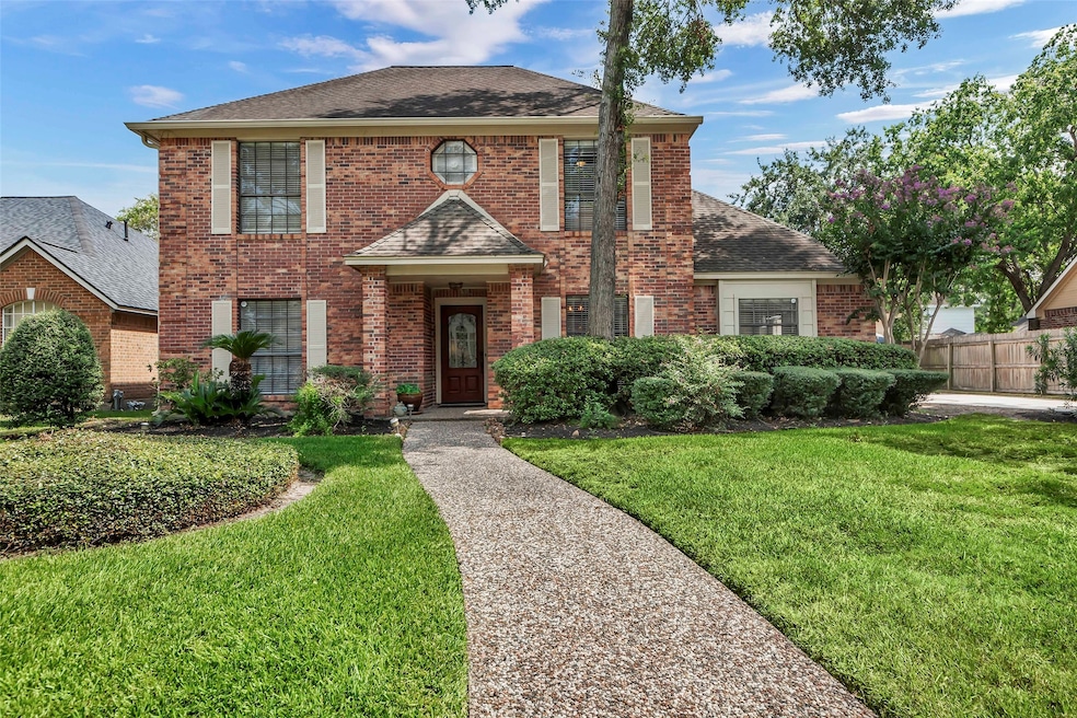 This charming two-story brick home features a clas