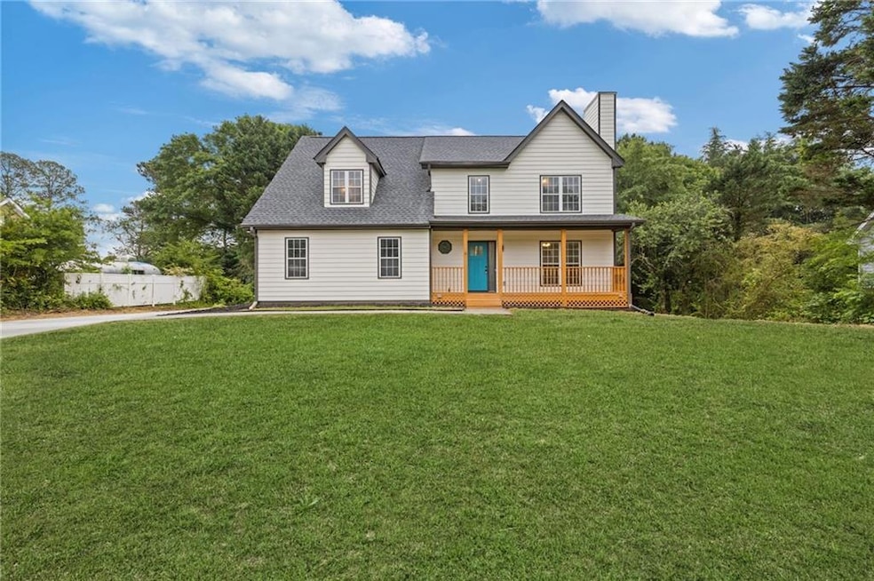 View of front of property with fence, a shingled r