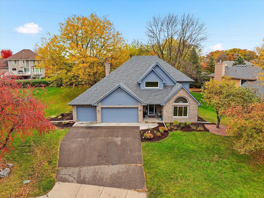 Beautiful two-story home featuring a striking brick and blue-gray exterior with a 3-car garage. The property is set on a well-maintained Cul de sac lot surrounded by mature trees, offering great curb appeal and a welcoming presence.