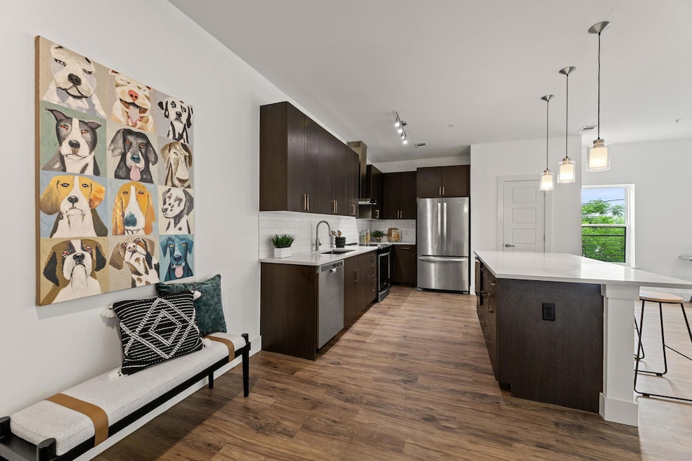 Kitchen with a sink, stainless steel appliances, 
