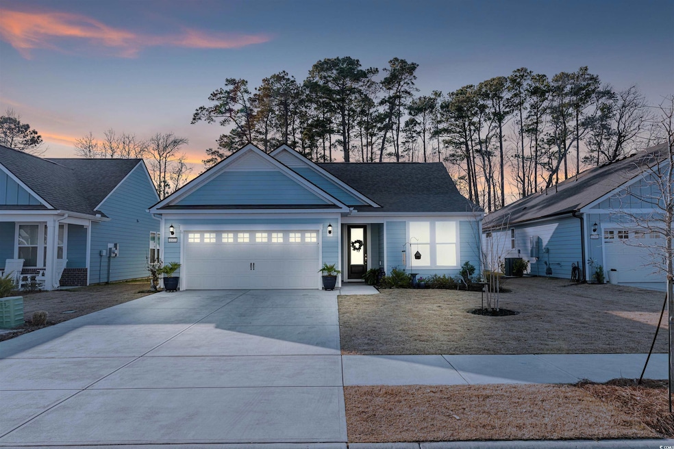 View of front of property featuring driveway and a