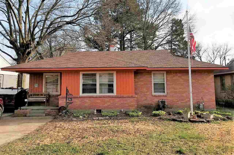 Brick home with a front porch.