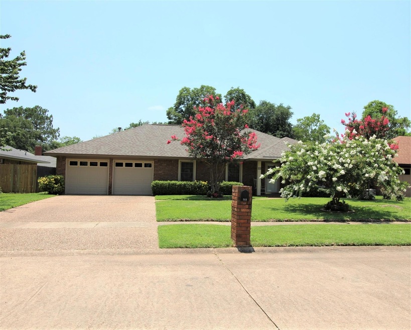 FRONT: Great curb appeal. Both garage doors replac