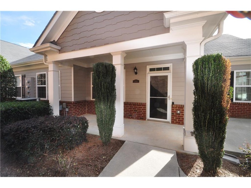Private entry with open patio and covered front po