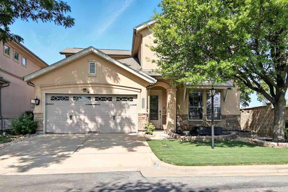 View of front of home featuring stucco siding, st