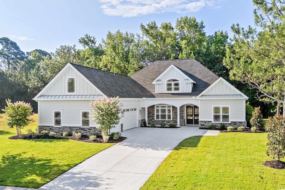 View of front of property with a garage and a fron