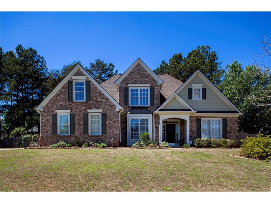 Handsome brick front three sided cement siding hom