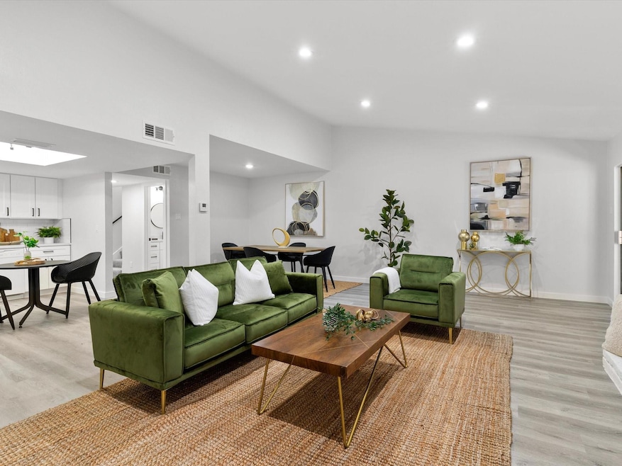 Living room with light hardwood / wood-style floor