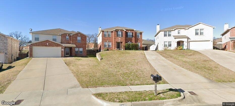 View of front of house featuring a garage and a fr