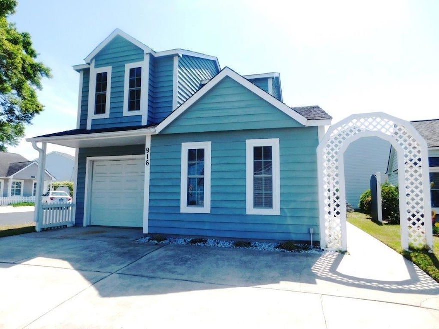 View of front facade featuring an attached garage 