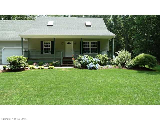 Exterior Front. Beautifully landscaped yet easy to