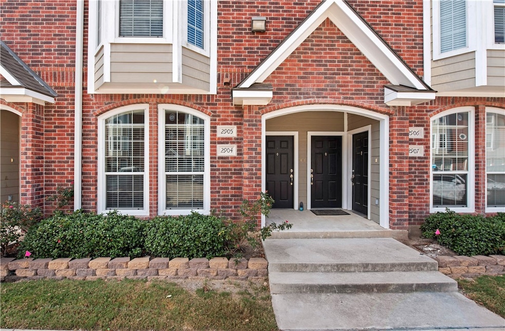Doorway to property with brick siding