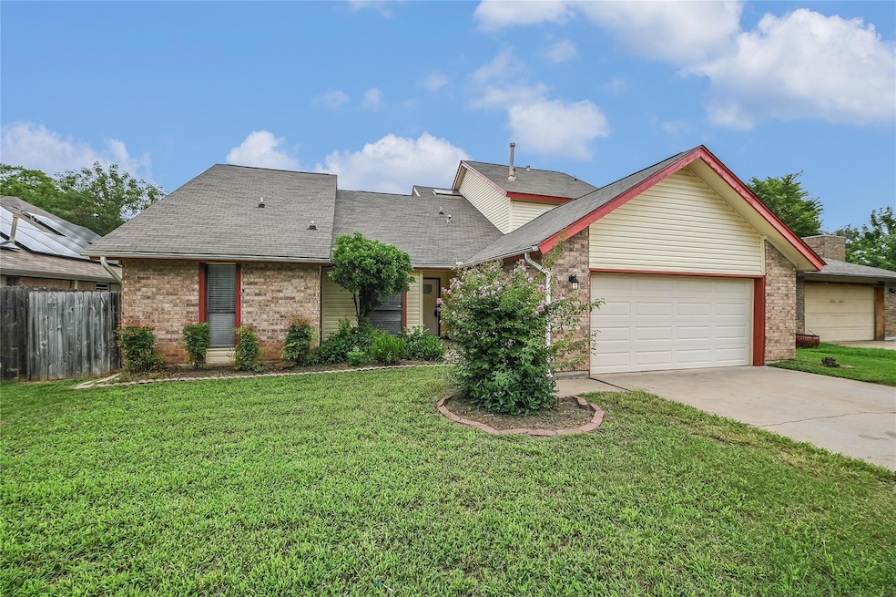 View of front of house featuring brick siding, a 