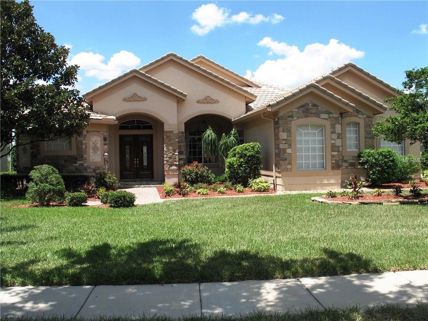 FRONT WITH STONE FACADE AND TILE ROOF