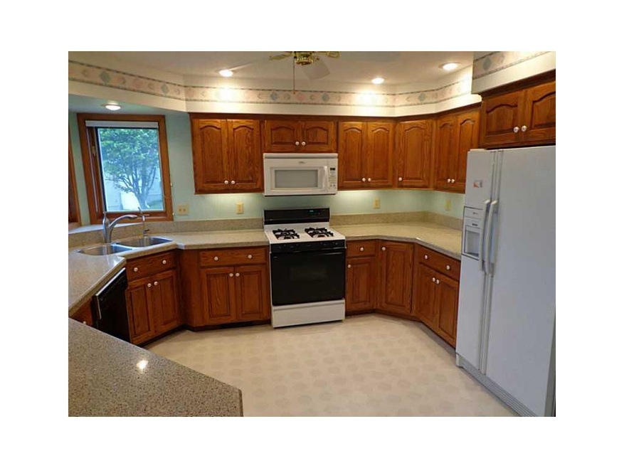 . Kitchen with granite counter tops, breakfast bar