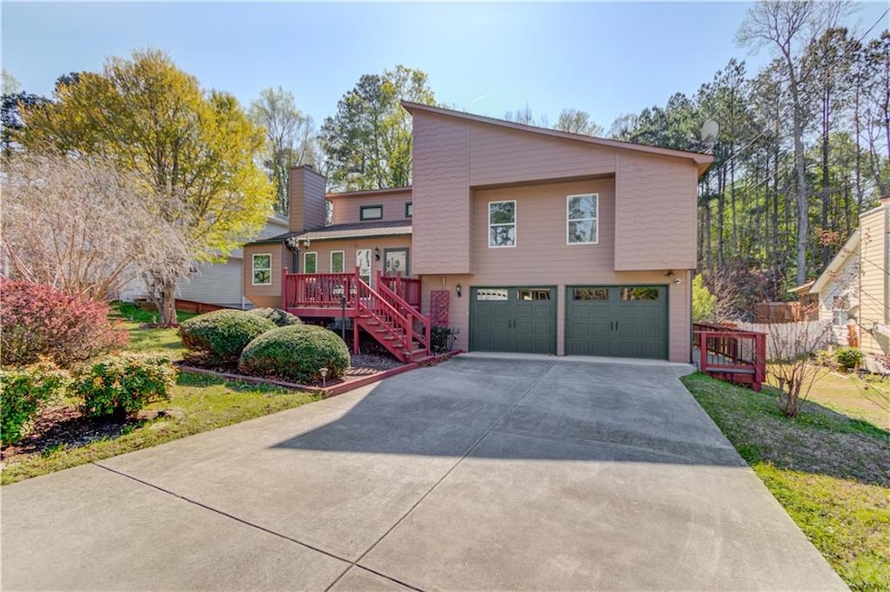 View of front of property featuring concrete drive