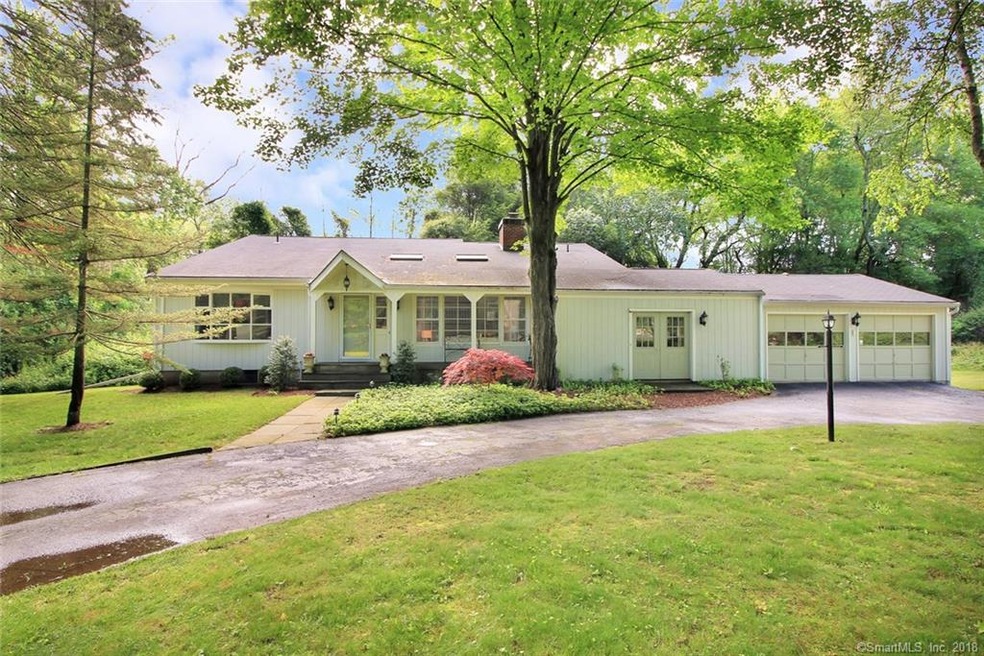 This contempory cape is set off country road with 