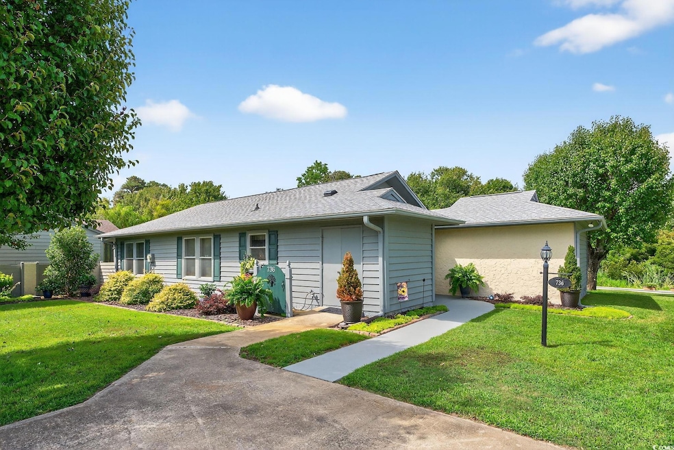 Ranch-style home with a front lawn and roof with shingles