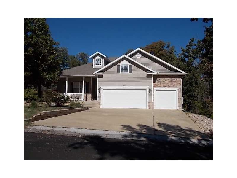 Exterior Front. Contemporary Home with 3 car garage on cul-de-sac street