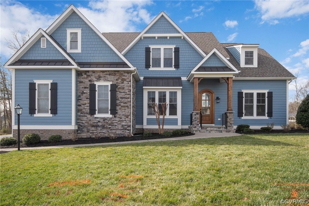 Craftsman-style home featuring a front lawn