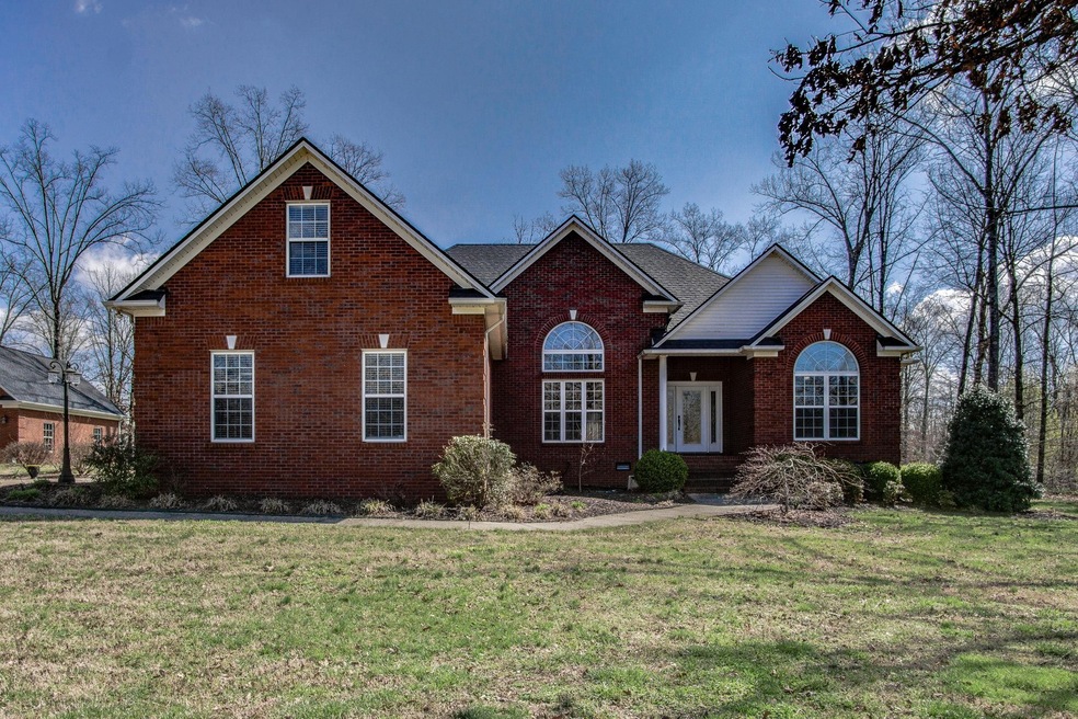 Beautiful all brick home on a wooded 1 acre lot