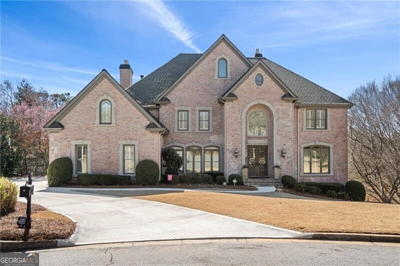View of front of house featuring brick siding, con