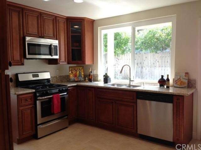 Gorgeous Granite!! Big New Windows!! Light and Bri