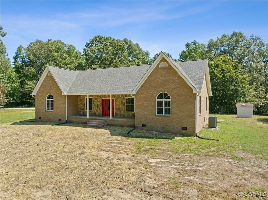 View of front of property featuring a porch, a front lawn, and central AC unit