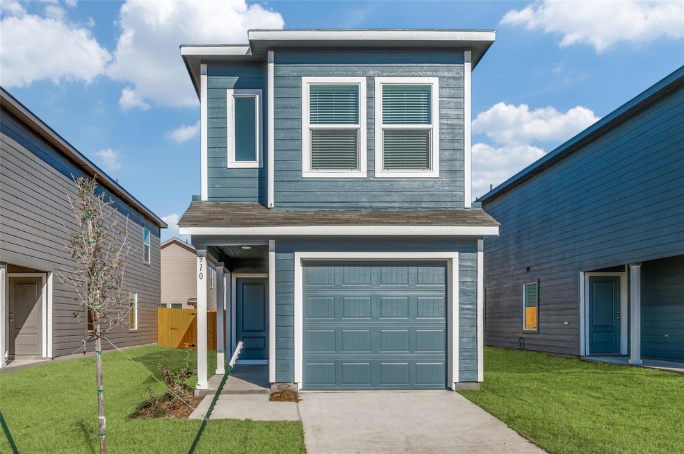 View of front of house featuring a garage and a fr