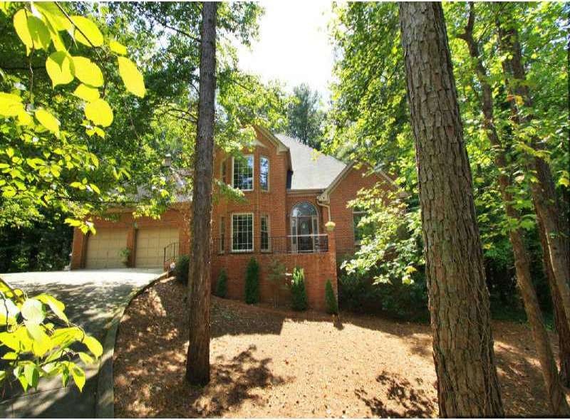Exterior Front. Four-sided brick house on a one+ a