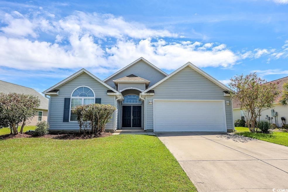 Ranch-style house with driveway, a front lawn, and a garage