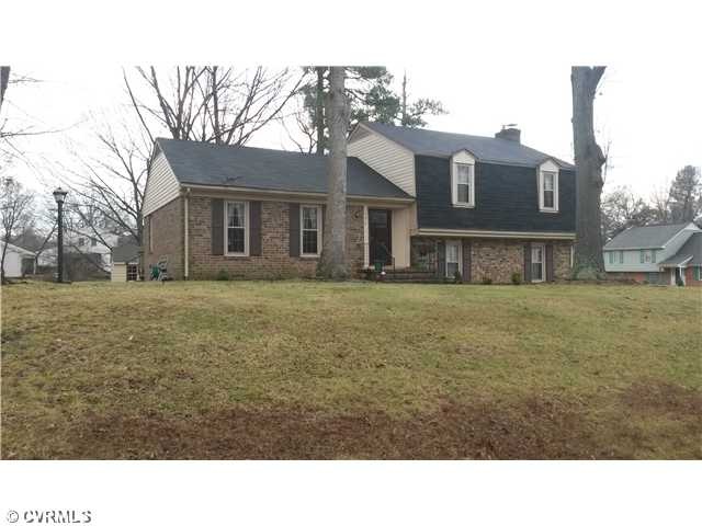 Exterior Front - corner elevated lot