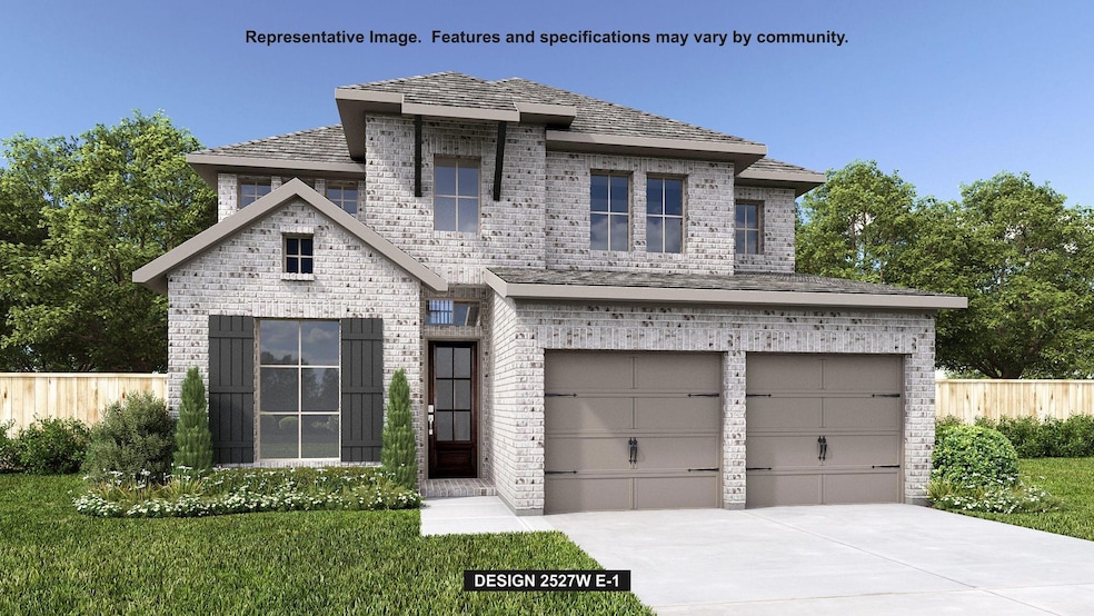 View of front of house featuring brick siding, concrete driveway, and a garage